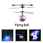 Colorful LED flying ball toy with spinning rotor blades, shown in bright and dark settings