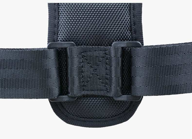 Close-up of black nylon strap with reinforced stitching and durable plastic buckle