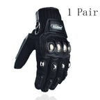 Black Madbike motorcycle gloves with protective metal knuckles and finger guards, one pair shown