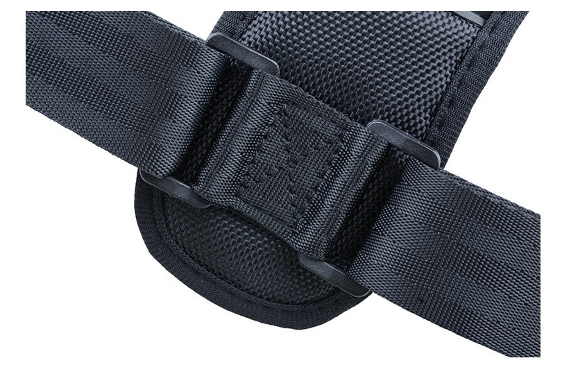 Close-up of black adjustable nylon strap with reinforced stitching and plastic loops