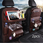 Brown leather car seat organizers with tablet holder, drink pockets, tissue dispenser, and storage compartments