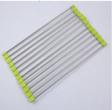 Stainless steel kitchen drying rack with green silicone edges on white background