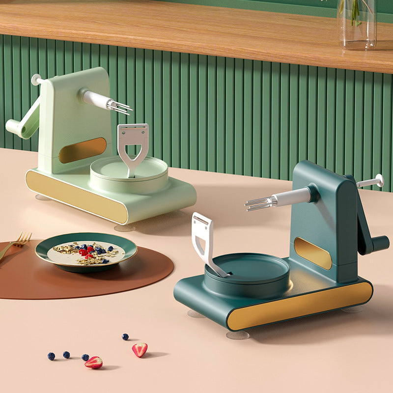 Two modern manual kitchen dough mixers in green and teal on a beige countertop with a bowl of cereal and berries