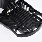 Black plastic foot pedal with textured grip, metal screws, and adjustable hinge mechanism on white background