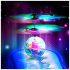 Colorful glowing helicopter toy with spinning propellers and illuminated translucent sphere base