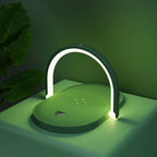 modern green wireless charger with LED light arch on green table and background