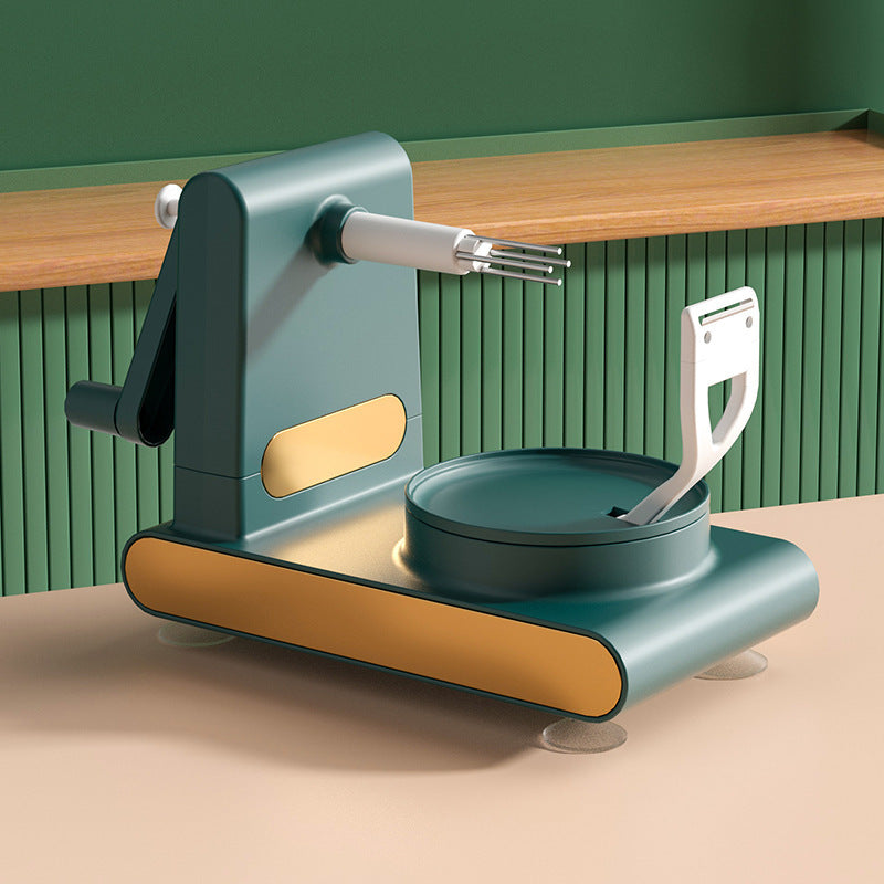 Manual pasta maker with a white dough cutter and teal-gold design on a beige countertop