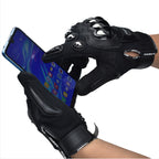 Hands wearing black protective motorcycle gloves using a smartphone touchscreen