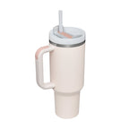 Beige insulated travel mug with handle, lid, and straw on white background