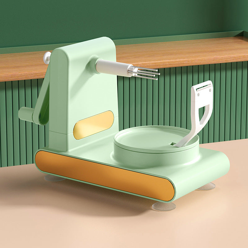 Mint green manual pasta maker with wooden countertop and green wall background