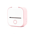 Compact pink and white portable label printer with power button and paper slot