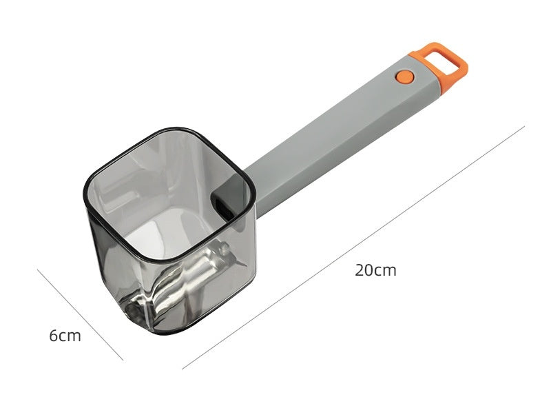 Gray and orange coffee scoop with transparent measuring cup, 20cm long, 6cm wide