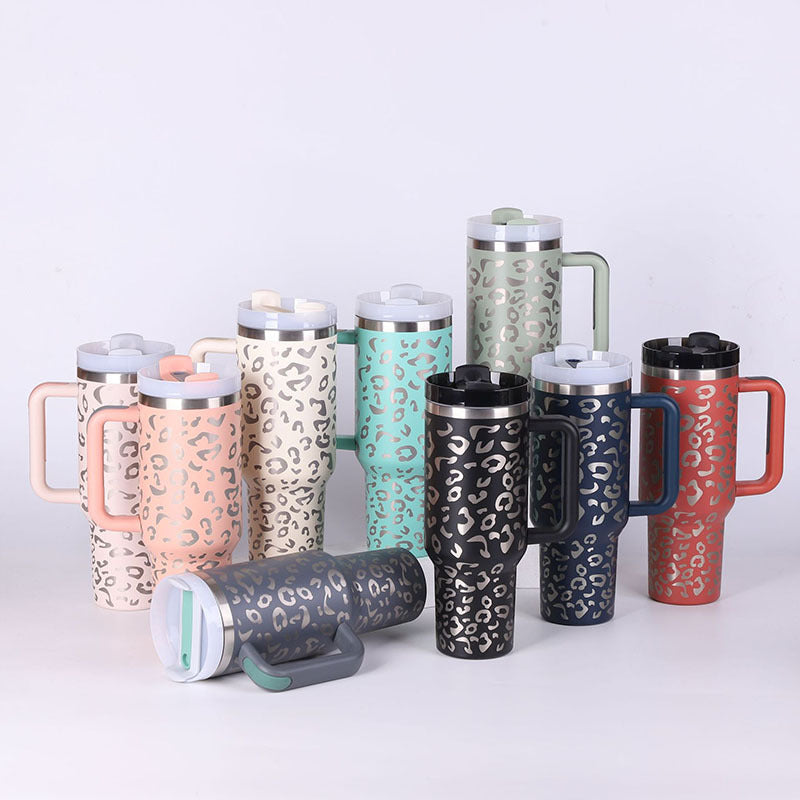 Set of colorful leopard print travel mugs with handles and lids in pastel and dark colors