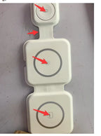 White modular wireless charging pads with red arrows pointing to USB-C ports on a gray surface