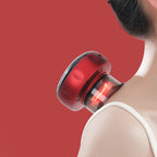 Red handheld electric massager applied to shoulder of person with white strap top on red background