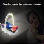 Wireless charging pad with glowing light arch charging smartphone beside sleeping woman, overcharge protection