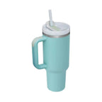 Light blue insulated travel mug with handle, white lid and straw on white background