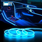 Car interior illuminated with blue LED ambient light strips outlining dashboard and doors