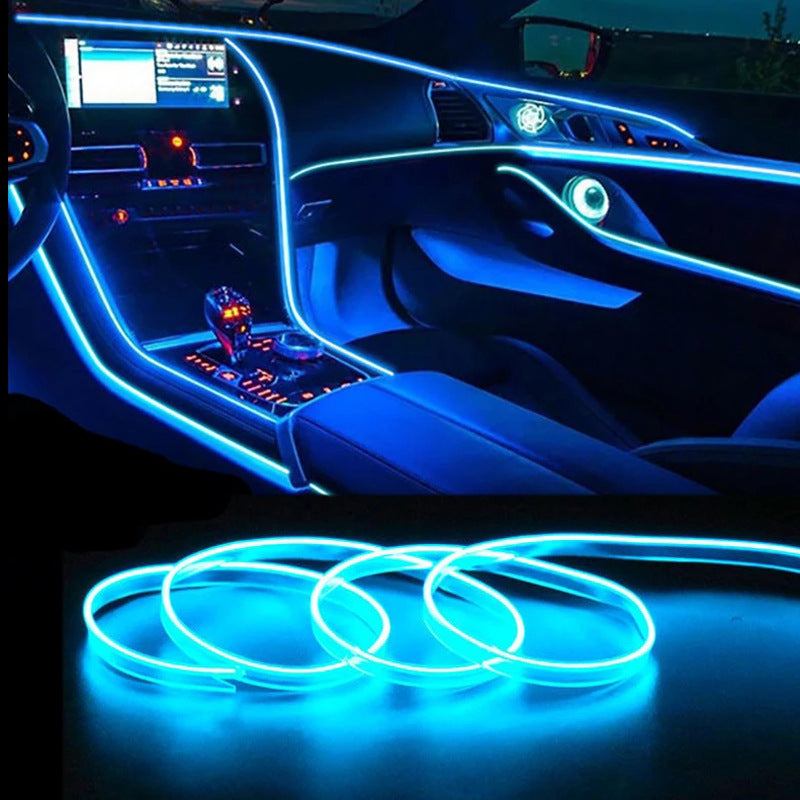 Car interior illuminated with blue LED ambient light strips outlining dashboard and doors