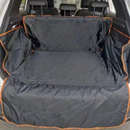 Black waterproof car trunk liner with orange trim protecting SUV cargo area and rear seats